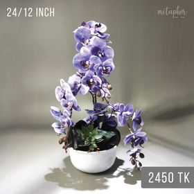 Artifical orchid arrangement in ceramic pot