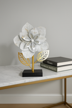 Load image into Gallery viewer, "Metal flower sculpture with white layered petals and golden leaves on black base""Metal flower sculpture with white layered petals and golden leaves on black base"