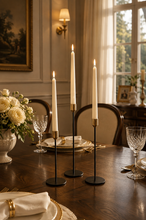 Load image into Gallery viewer, 3-piece black and gold metal candle holder set with battery-powered LED taper candles in graduated heights