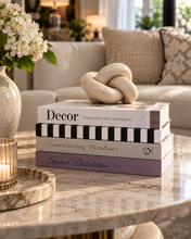 Load image into Gallery viewer, 4 piece decorative fake book set displayed vertically on dark console table with marble bookend