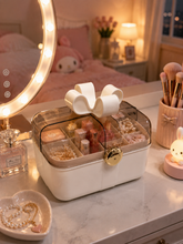 Load image into Gallery viewer, Bow Belle pink portable makeup organizer with bow handle beside round mirror in pink bedroom – MetaphorBD