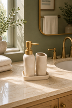 Load image into Gallery viewer, Cream Sculpted Calm three-piece ceramic bathroom set with 350 ml gold-toned pump soap dispenser, matching tumbler and rectangular tray.