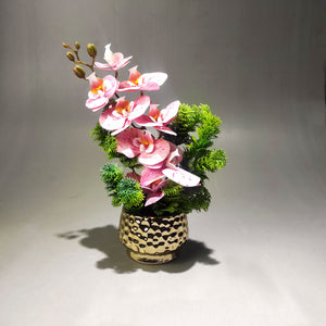 Artificial orchid arrangement in ceramic pot