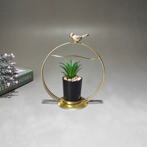 Artificial cactus arrangement in metal ring bird on top