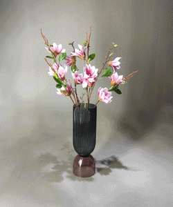 Artificial flower arrangement in thik glass crafted designers vase