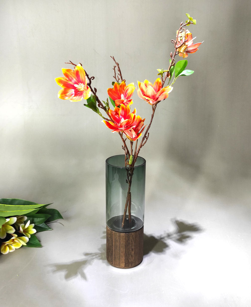 Artificial flower arrangement in thik glass crafted designers vase wooden base
