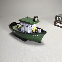 Load image into Gallery viewer, Mini fishing boat resin showpiece in green and black on wooden shelf