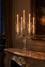 Load image into Gallery viewer, Luxury crystal 5-arm candelabra candle holder with hanging crystal droplets and clear glass candle cups displayed as an elegant dining table centerpiece.