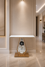 Load image into Gallery viewer, Luxury marble top console table with gold metal frame and decorative floral base for modern home interiors.