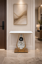 Load image into Gallery viewer, Luxury marble top console table with gold metal frame and decorative floral base for modern home interiors.