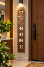 Load image into Gallery viewer, Brown farmhouse-inspired vertical Welcome Home wall sign for entrance décor, 47 × 8 inches – Metaphor BD
