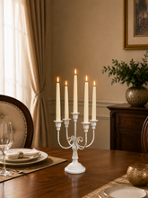 Load image into Gallery viewer, White 5-arm metal candelabra candle holder, 20 × 8 inch, styled on an elegant dining table.