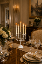 Load image into Gallery viewer, White 5-arm metal candelabra candle holder, 20 × 8 inch, styled on an elegant dining table.