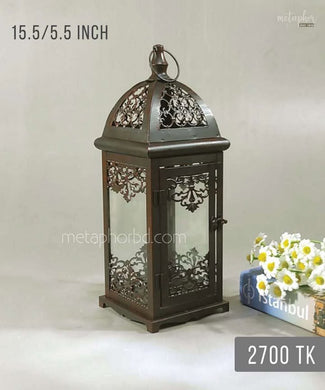 Add charm and ambient glow to your space with this 15.5-inch vintage decorative metal lantern. Perfect for candles, LED lights, and festive décor.