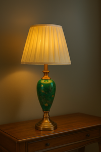 Elegant green ceramic vintage table lamp with pleated shade on wooden console
