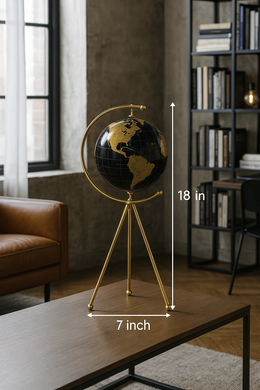 18-inch black and gold decorative globe with tripod stand on wooden table