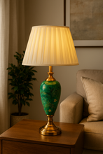 Load image into Gallery viewer, Elegant green ceramic vintage table lamp with pleated shade on wooden console
