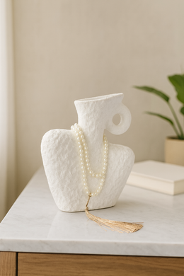 White textured abstract sculpture vase on marble-top console – MetaphorBD