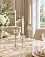 Load image into Gallery viewer, Crystal Bloom 3-piece rose gold candle holder set with crystal flower accents and glass bases on marble dining table
