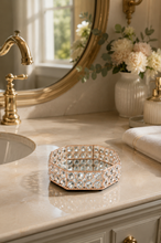 Load image into Gallery viewer, Crystal Halo octagonal vanity tray with rose-gold-toned metal frame, faceted crystal-glass border and mirrored base, measuring 8.5 × 7 × 2 inches.

