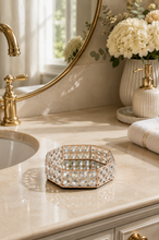 Load image into Gallery viewer, Crystal Halo octagonal vanity tray with rose-gold-toned metal frame, faceted crystal-glass border and mirrored base, measuring 8.5 × 7 × 2 inches.
