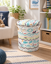 Load image into Gallery viewer, White nautical-patterned stool with colourful fish, sailboats and waves in a coastal-style living room.
