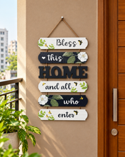 Load image into Gallery viewer, Bless This Home floral wooden hanging welcome sign with black and white panels, botanical artwork and HOME lettering, 24 × 12 inches – Metaphor BD
