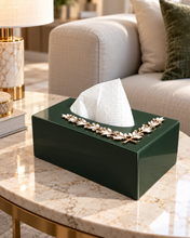 Load image into Gallery viewer, Emerald green glass tissue box with gold-tone crystal leaf accent on a marble coffee table
