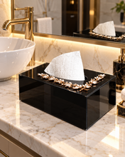 Load image into Gallery viewer, Black glass tissue box with gold-tone leaf decoration on a vanity countertop
