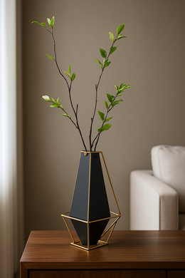 Black and gold geometric metal vase with artificial flower arrangement – modern home décor.