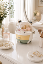 Load image into Gallery viewer, Cute cat-shaped makeup and jewellery organizer with transparent dust cover and two storage drawers, measuring 10 inches high, 10 inches wide and 9 inches deep.
