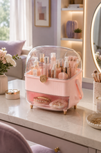 Load image into Gallery viewer, Pink covered makeup and jewellery organizer with transparent lid open showing skincare and cosmetics on dresser – MetaphorBD
