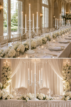 Load image into Gallery viewer, Large white 5-arm metal candelabra candle holder, 29 inches high and 13 inches wide, styled as an elegant wedding table centerpiece.
