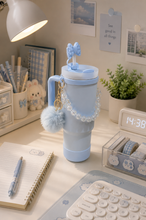 Load image into Gallery viewer, Green Pookie bow 1L tumbler with straw, handle and pom-pom charm on desk – MetaphorBD
