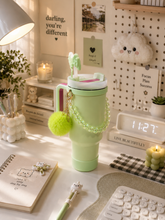 Load image into Gallery viewer, Pink Pookie bow 1L tumbler with straw, handle and pom-pom charm on dressing desk – MetaphorBD
