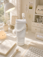 Load image into Gallery viewer, Pink Pookie bow 1L tumbler with straw, handle and pom-pom charm on office desk – MetaphorBD
