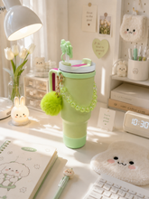 Load image into Gallery viewer, Pastel green 1 liter tumbler with handle bow detail beaded charm and pom pom
