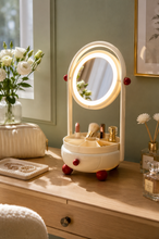 Load image into Gallery viewer, Beige Lumi LED vanity mirror and makeup organizer with illuminated oval glass mirror, divided tray and pull-out drawer on a dressing table.
