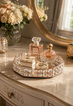 Load image into Gallery viewer, Crystal Halo octagonal vanity tray with rose-gold-toned metal frame, faceted crystal-glass border and mirrored base, measuring 8.5 × 7 × 2 inches.
