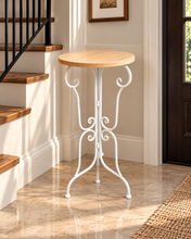 Load image into Gallery viewer, 26 inch tall Nordic accent table with 12 inch round natural wooden top and elegant white metal scrollwork frame – MetaphorBD
