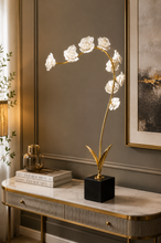 Load image into Gallery viewer, Luxury gold metal floral sculpture with white blooming flowers on a black base for console table, living room, and modern home décor.2
