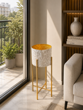 Load image into Gallery viewer, Luxury white embossed metal planter with gold interior and gold metal stand for indoor home décor.
