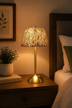 Load image into Gallery viewer, Modern decorative bedside table lamp with brushed gold metal base and colorful artistic fabric lampshade measuring 11.5 x 5.5 inches
