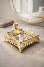 Load image into Gallery viewer, Square gold mirror vanity tray with ornate metal detailing for perfumes and jewelry
