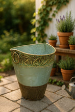 Load image into Gallery viewer, Tall green antique metal planter with embossed leaf design and rustic bronze base
