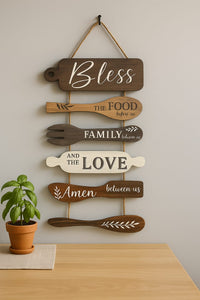 Rustic wooden wall hanging with Bless, Food, Family, Love, Amen typography