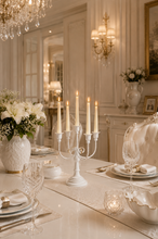 Load image into Gallery viewer, White 5-arm metal candelabra candle holder, 20 × 8 inch, styled on an elegant dining table.
