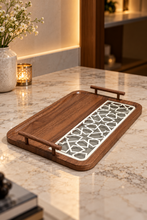 Load image into Gallery viewer, Walnut-finish rectangular decorative tray with raised bar handles and ivory geometric lattice detailing over a grey inset.
